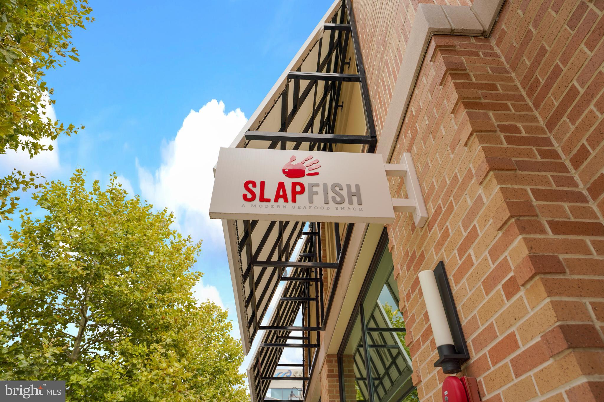 20364 Newfoundland Square Ashburn, VA 20147 - Photo 56 of 68 a view of swings and sign on a wall