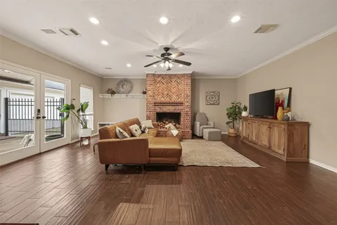 a dining room with wooden floor and a window