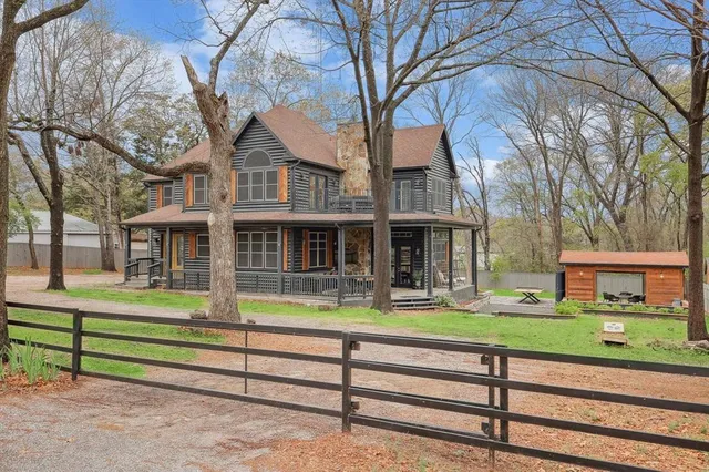 a front view of a house with a yard table and chairs