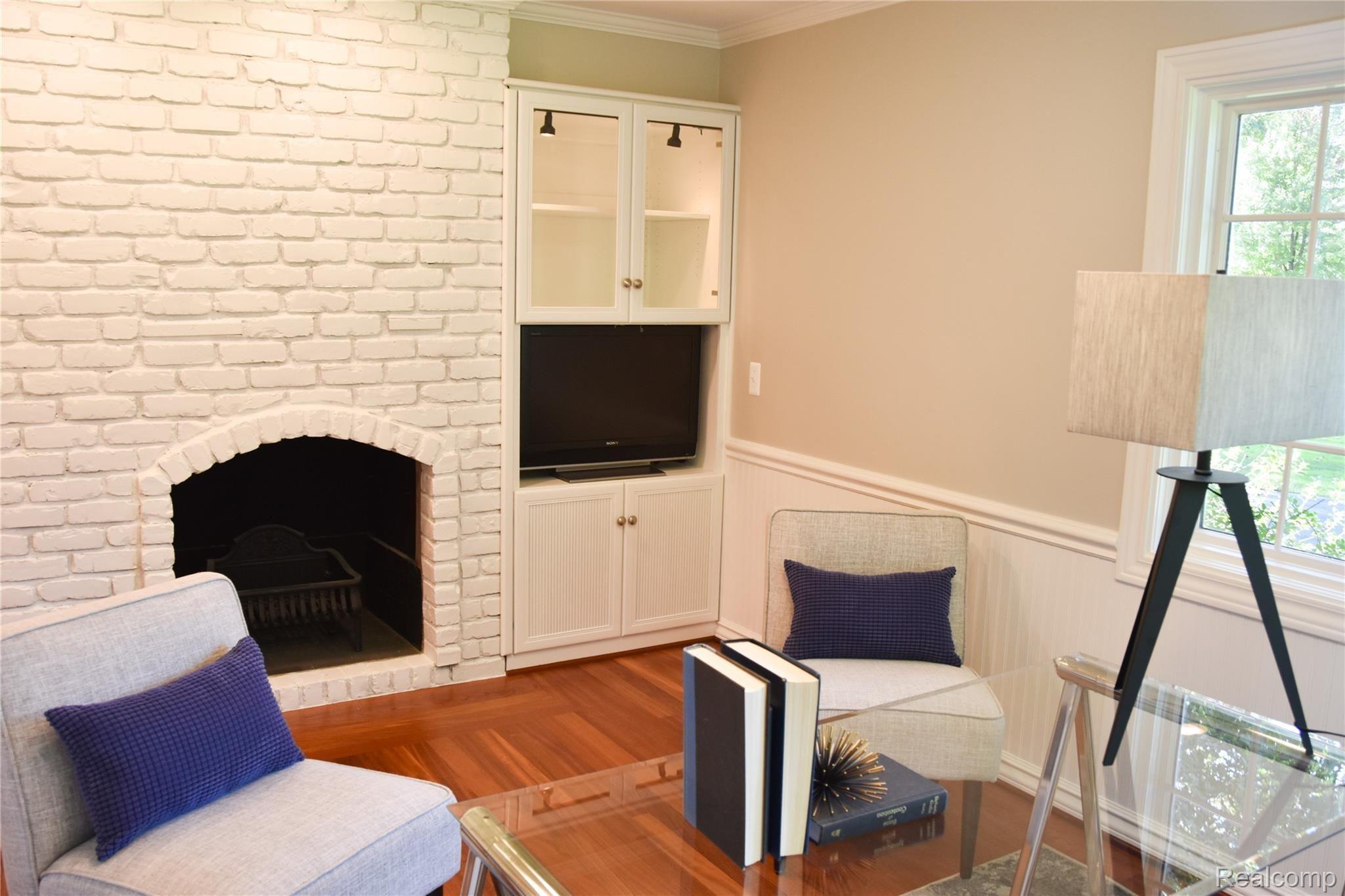 1580 Tottenham Road Bloomfield Hills, MI 48301 - Photo 13 of 48 Cozy natural fireplace in room off kitchen