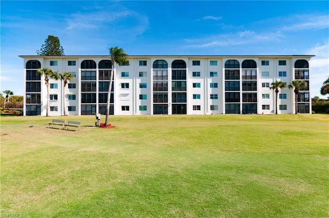 a view of a large building with a large yard