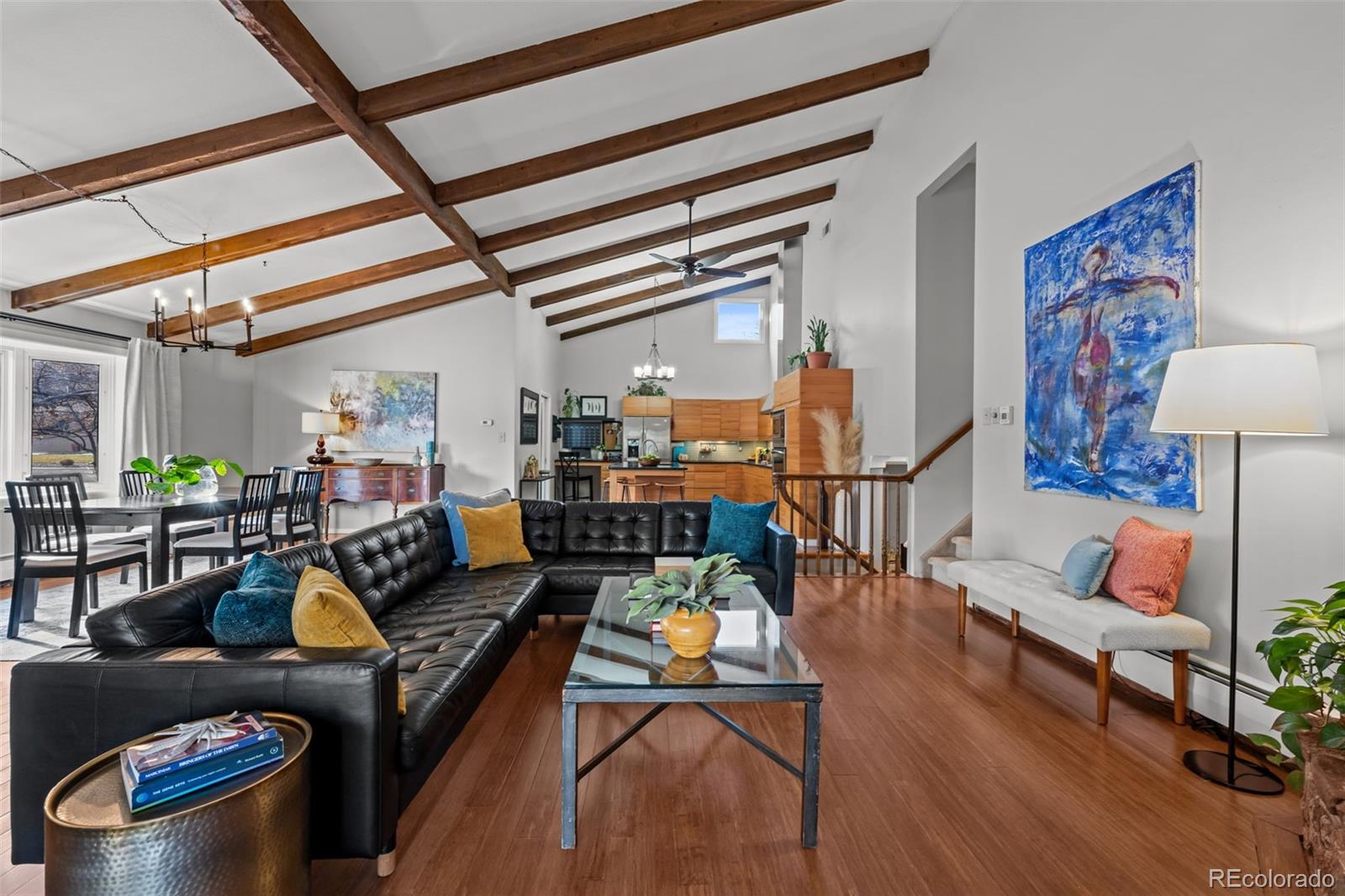 1 Rangeview Drive Wheat Ridge, CO 80215 - Photo 1 of 45 a living room with furniture a rug and a chandelier