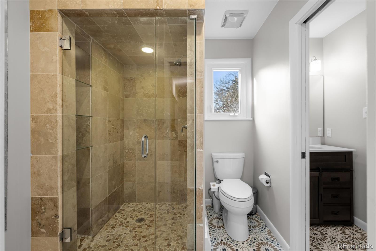 1 Rangeview Drive Wheat Ridge, CO 80215 - Photo 19 of 45 a bathroom with a toilet and a shower