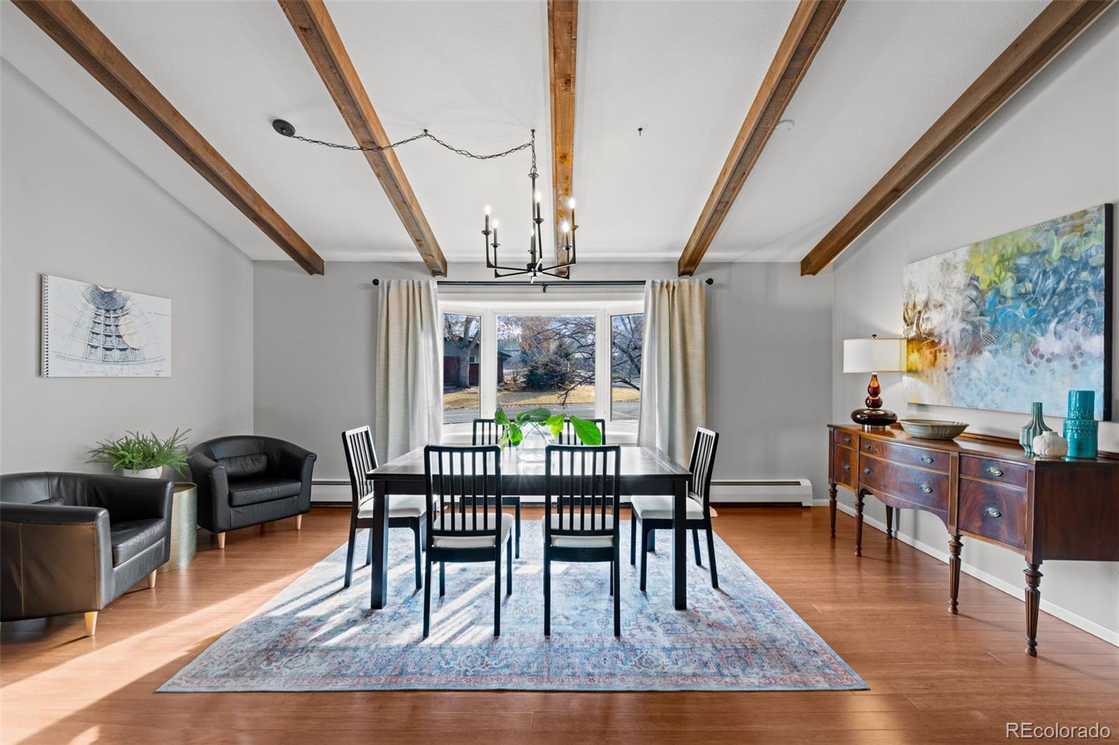 1 Rangeview Drive Wheat Ridge, CO 80215 - Photo 2 of 45 a dining room with furniture window and wooden floor