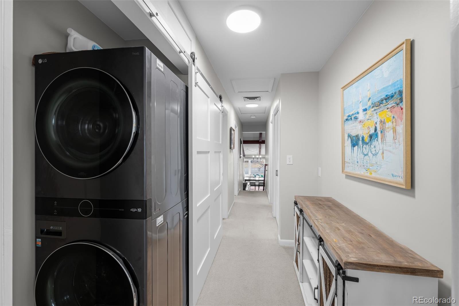 1 Rangeview Drive Wheat Ridge, CO 80215 - Photo 24 of 45 a view of a hallway with washer and dryer