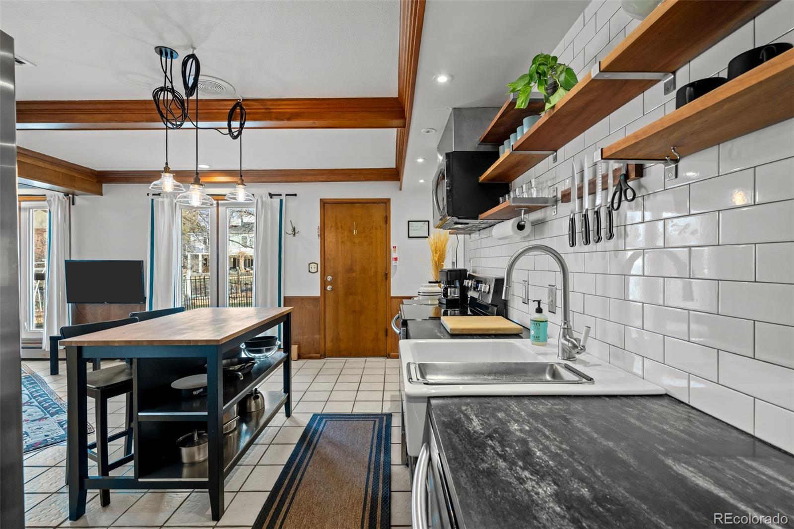 1 Rangeview Drive Wheat Ridge, CO 80215 - Photo 30 of 45 a view of a dining room with furniture window and wooden floor