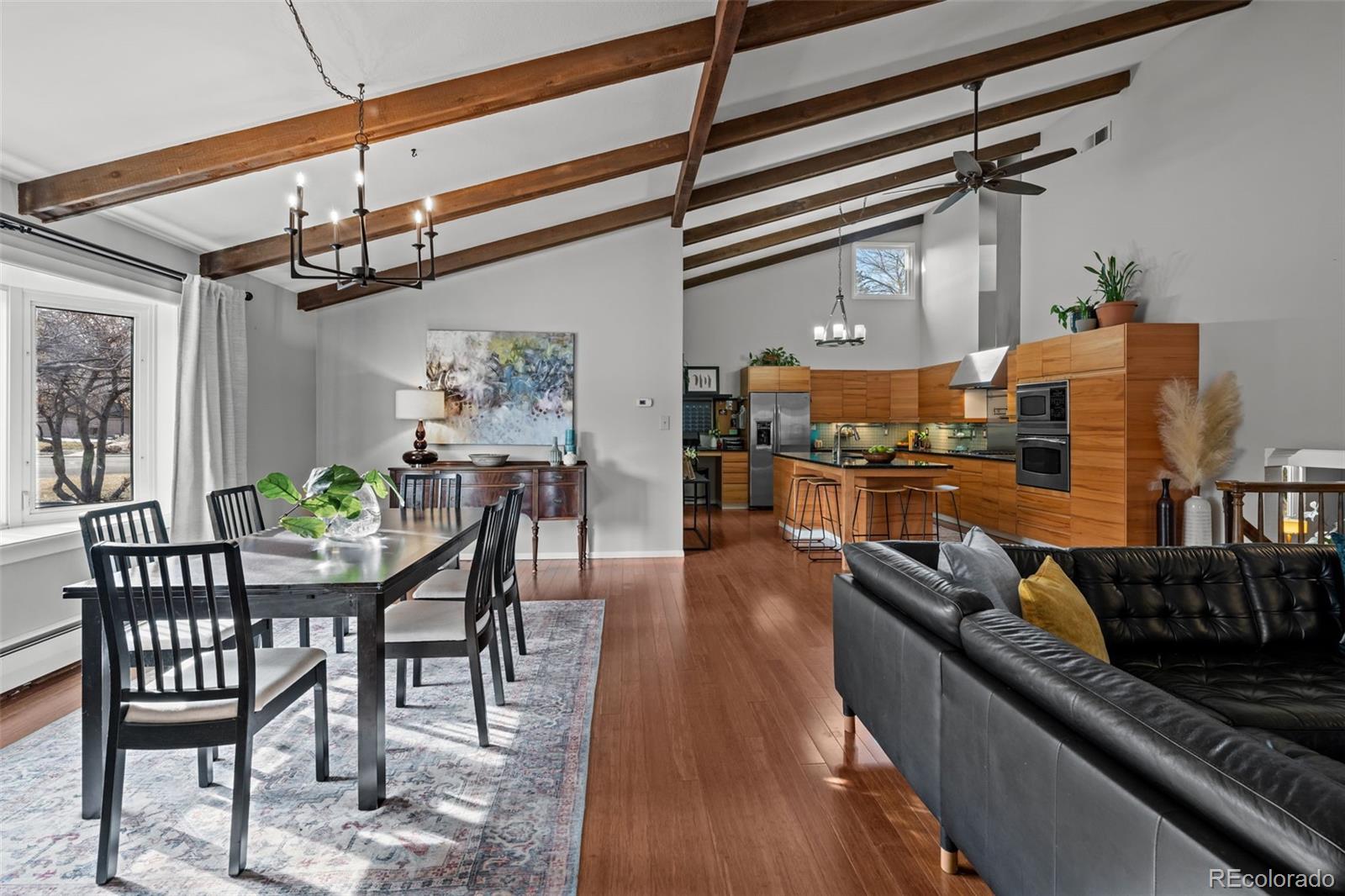 1 Rangeview Drive Wheat Ridge, CO 80215 - Photo 3 of 45 a view of a dining room with furniture window and wooden floor