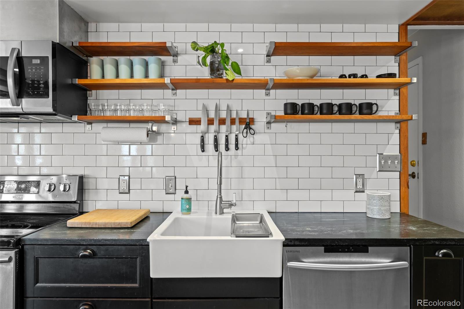 1 Rangeview Drive Wheat Ridge, CO 80215 - Photo 31 of 45 a kitchen with a sink and a stove