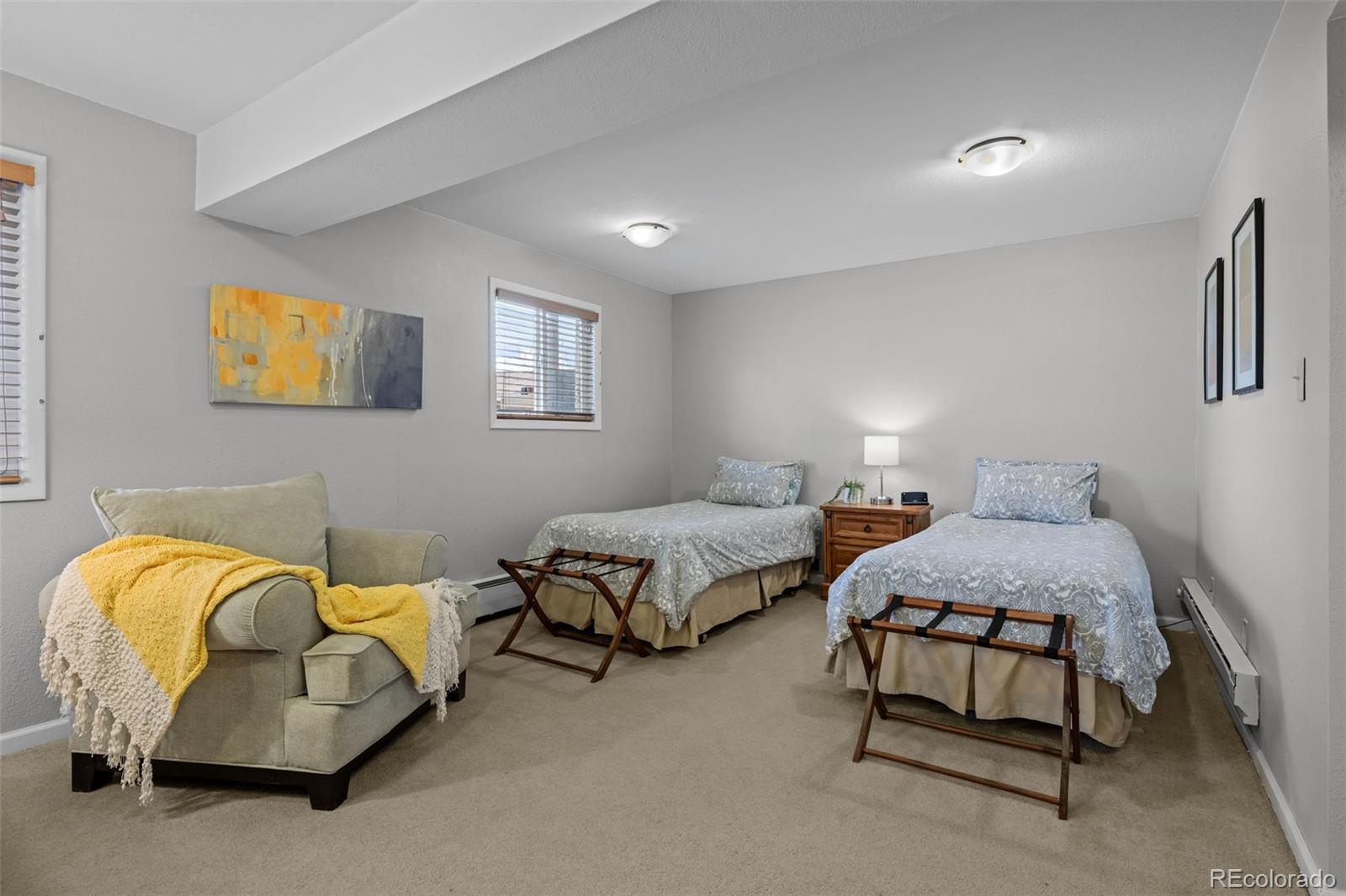 1 Rangeview Drive Wheat Ridge, CO 80215 - Photo 32 of 45 a bedroom with bed and a couch