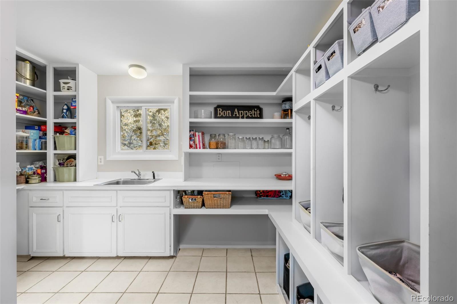 1 Rangeview Drive Wheat Ridge, CO 80215 - Photo 33 of 45 a room with cabinets and furniture