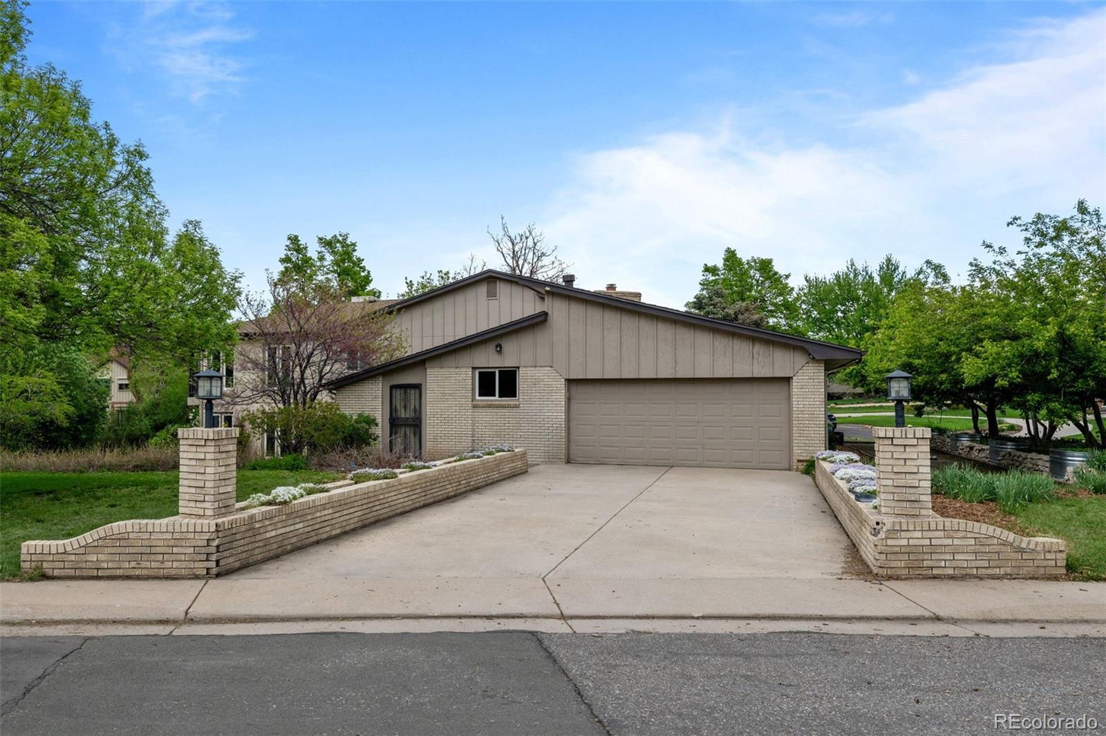 1 Rangeview Drive Wheat Ridge, CO 80215 - Photo 39 of 45 a backyard of a house with table and chairs