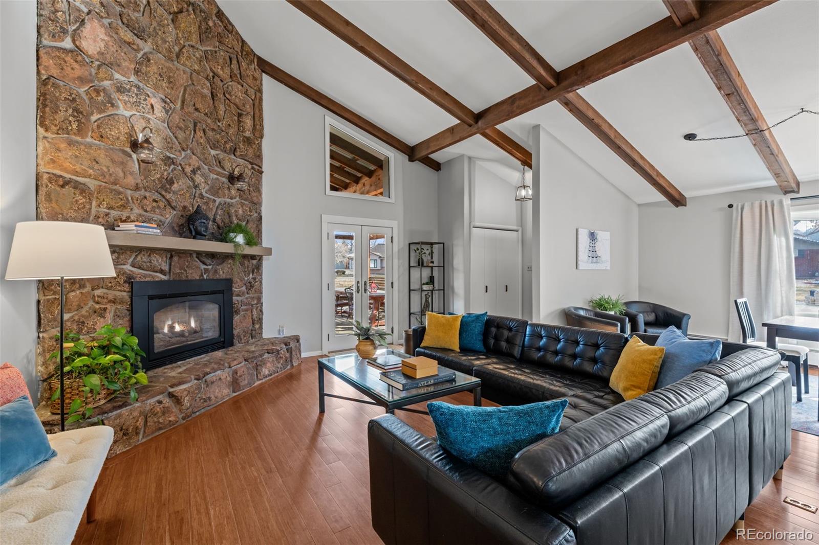 1 Rangeview Drive Wheat Ridge, CO 80215 - Photo 4 of 45 a living room with furniture and a fireplace