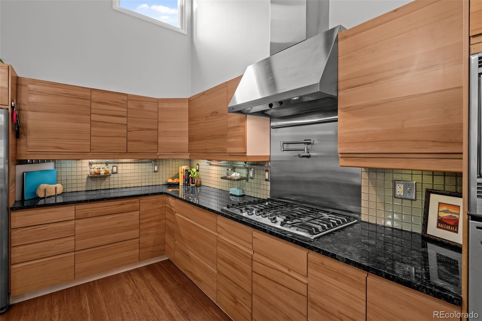 1 Rangeview Drive Wheat Ridge, CO 80215 - Photo 7 of 45 a kitchen with stainless steel appliances granite countertop a stove and a sink