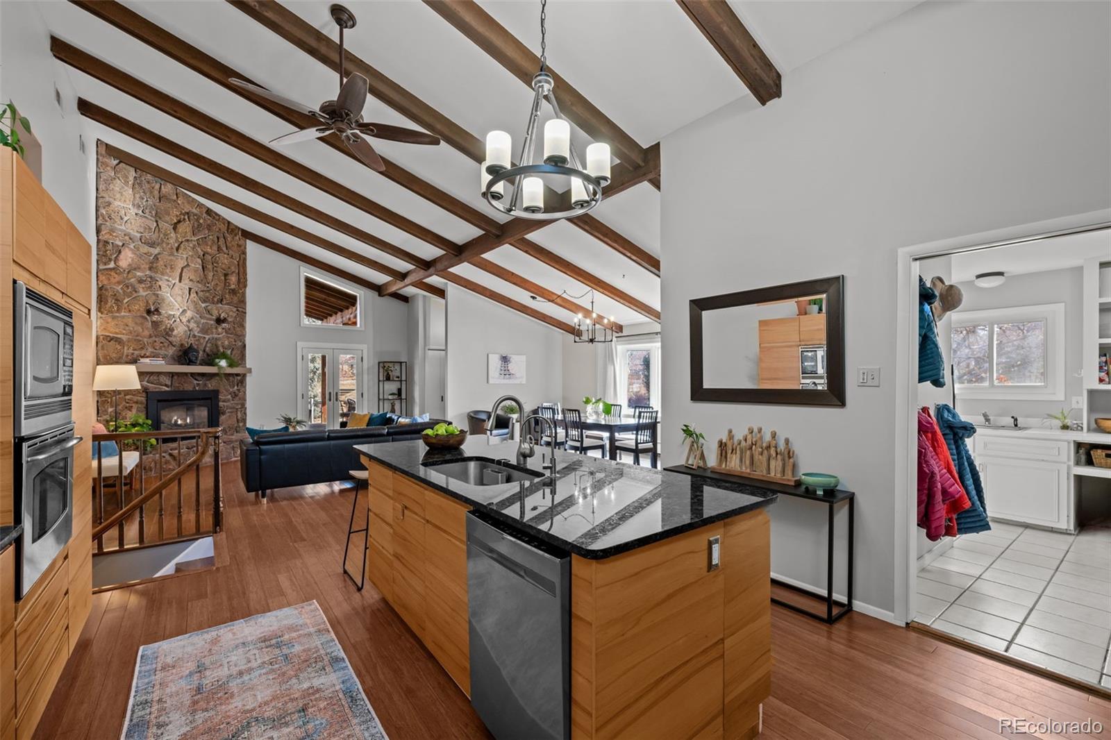 1 Rangeview Drive Wheat Ridge, CO 80215 - Photo 9 of 45 a kitchen with stainless steel appliances granite countertop a sink a stove and a wooden floors