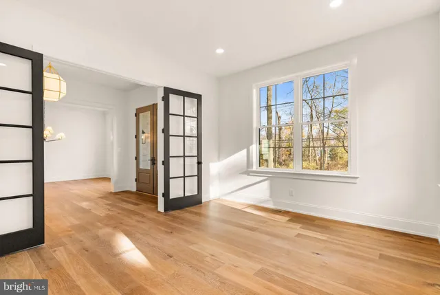 a kitchen with stainless steel appliances kitchen island granite countertop a stove a sink and a refrigerator