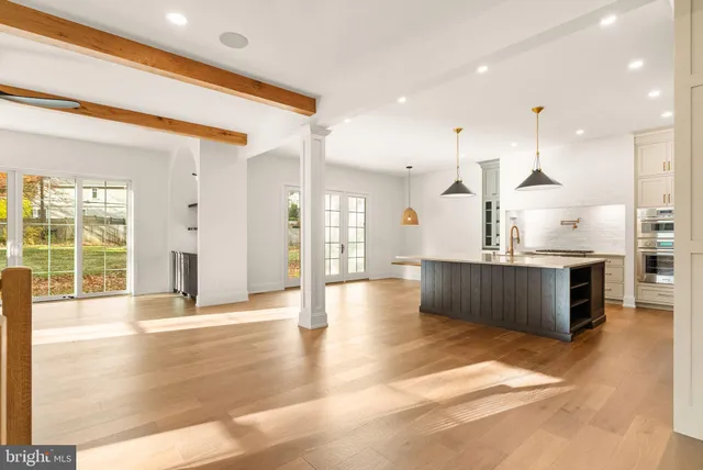 a view of staircase with wooden floor and a floor to ceiling window