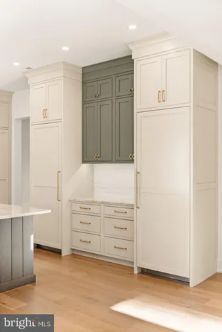 a bathroom with a shower sink and mirror