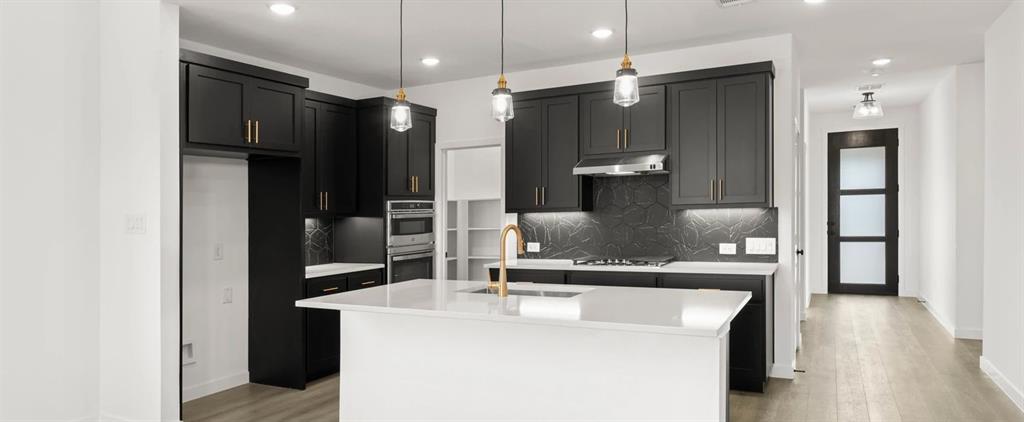 2306 Myrtle Way Melissa, TX 75454 - Photo 9 of 28 a kitchen with stainless steel appliances a refrigerator a sink and wooden floor