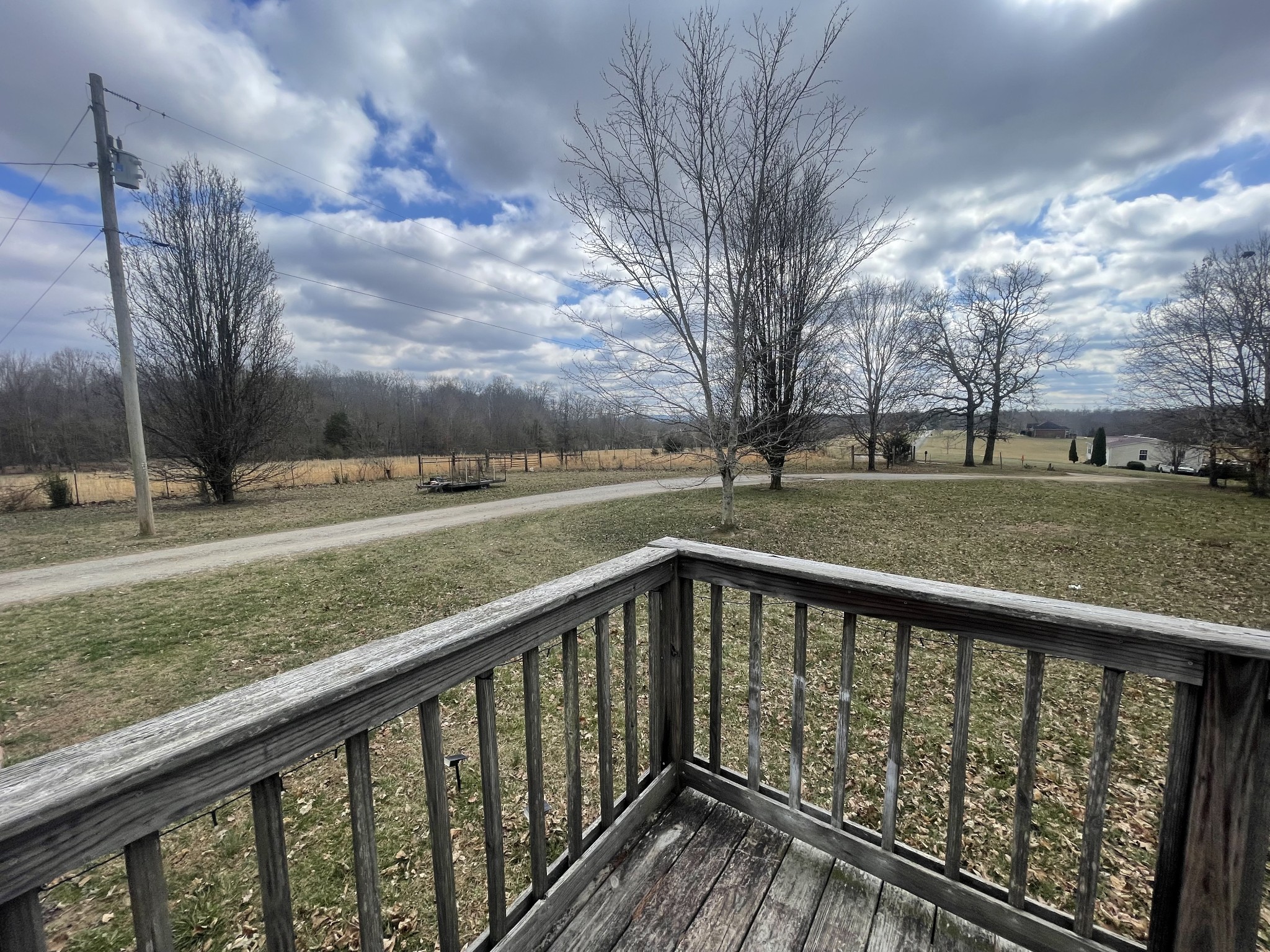 988 Womack Road McMinnville, TN 37110 - Photo 9 of 11 a view of a wooden deck with yard and trees in the background