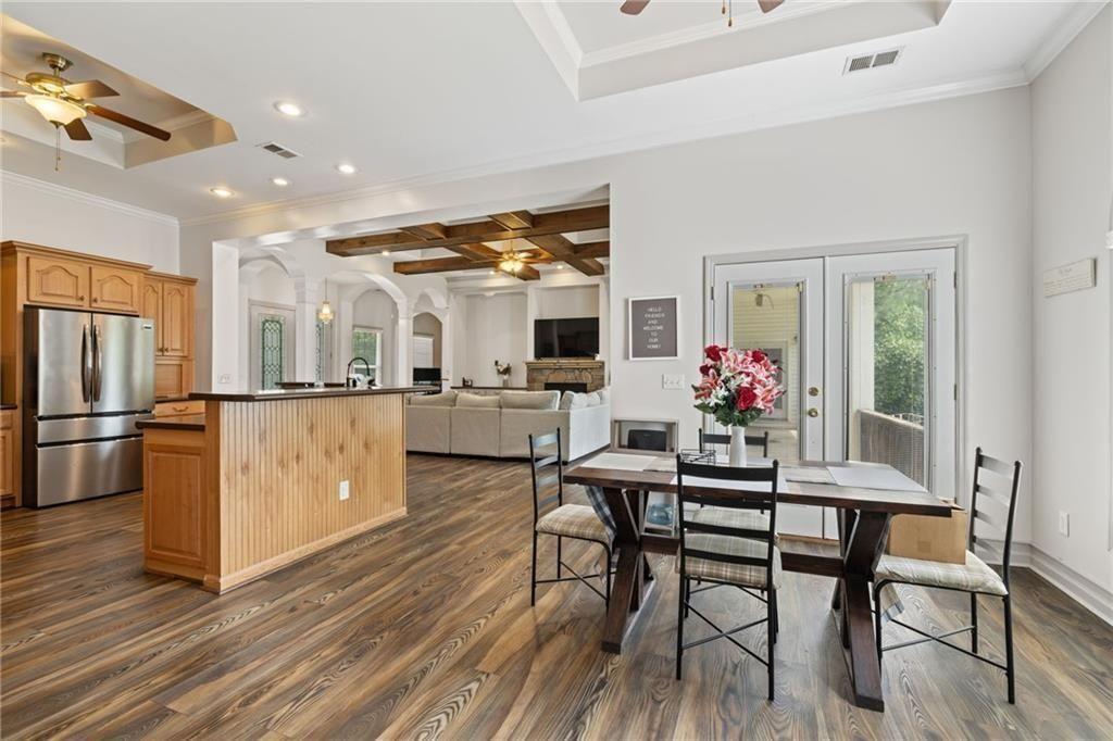 166 Freedom Lane Commerce, GA 30530 - Photo 13 of 25 a kitchen with furniture wooden floor and stainless steel appliances