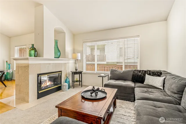 a kitchen with stainless steel appliances granite countertop a sink a stove microwave and cabinets