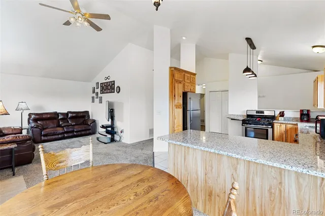 a kitchen with a stove a sink and cabinets