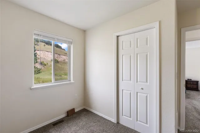 a view of room with furniture and cabinet