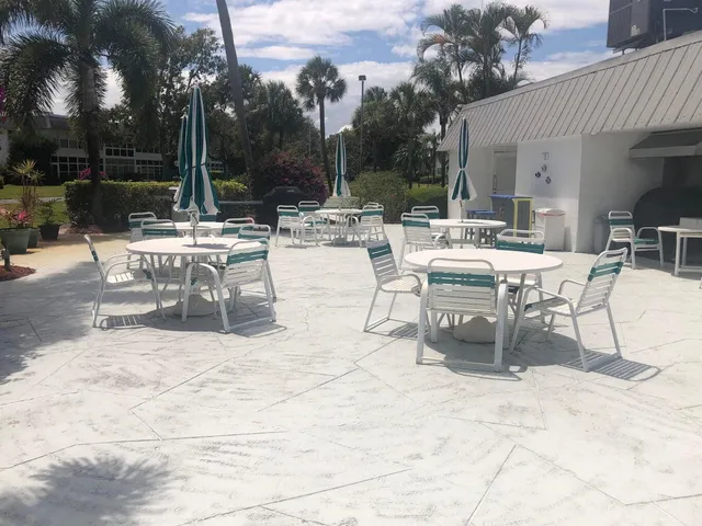 a view of a swimming pool with a patio