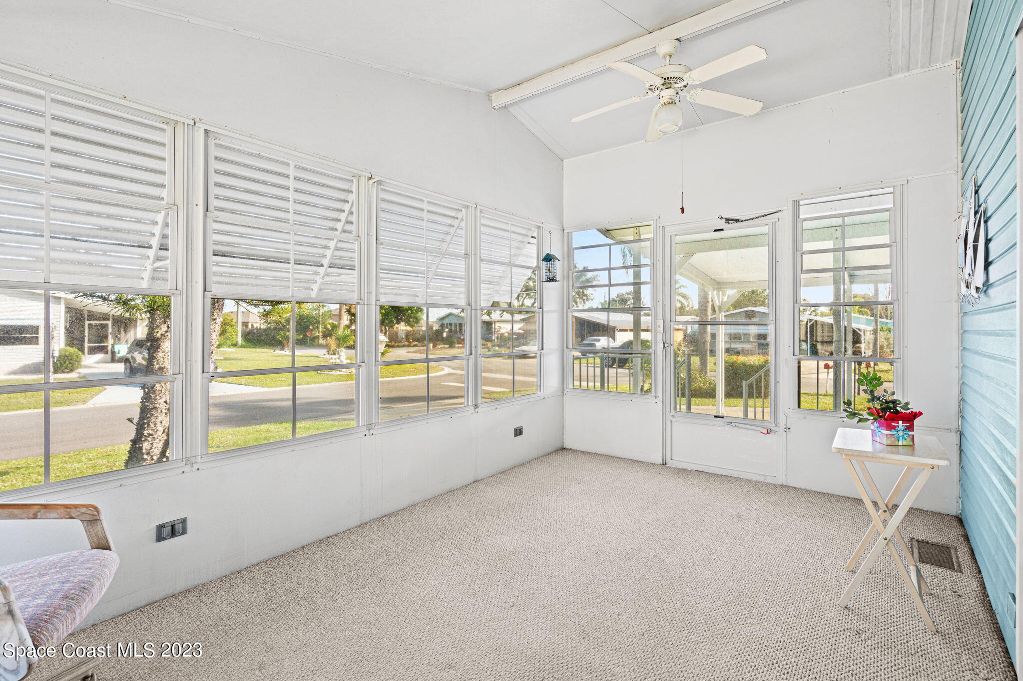 701 Gladiolus Drive Barefoot Bay, FL 32976 - Photo 13 of 19 a view of an empty room with a window
