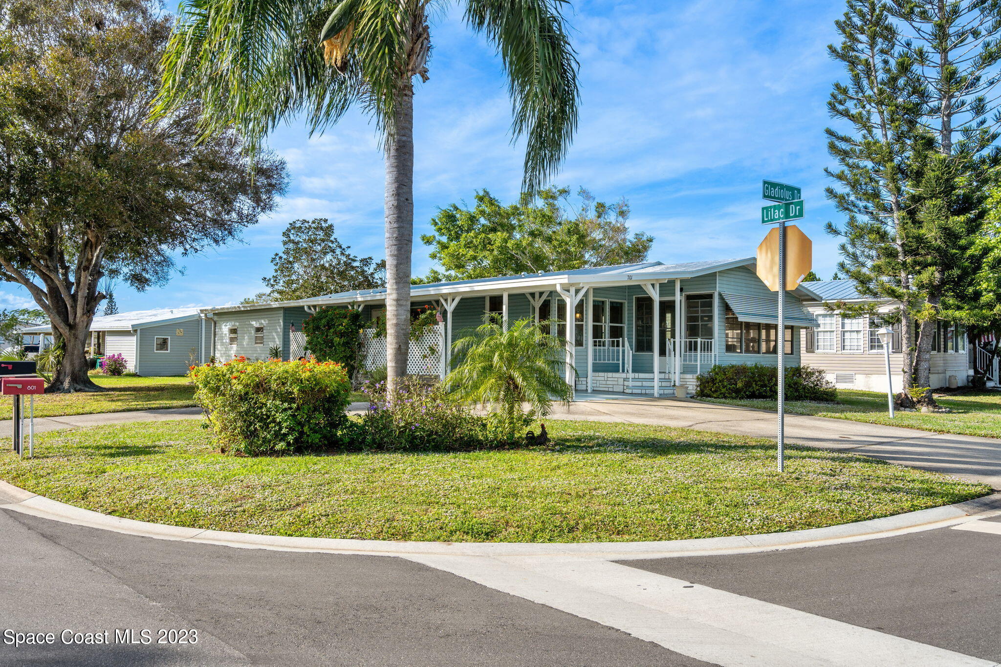 701 Gladiolus Drive Barefoot Bay, FL 32976 - Photo 16 of 19 a view of a house with a swimming pool