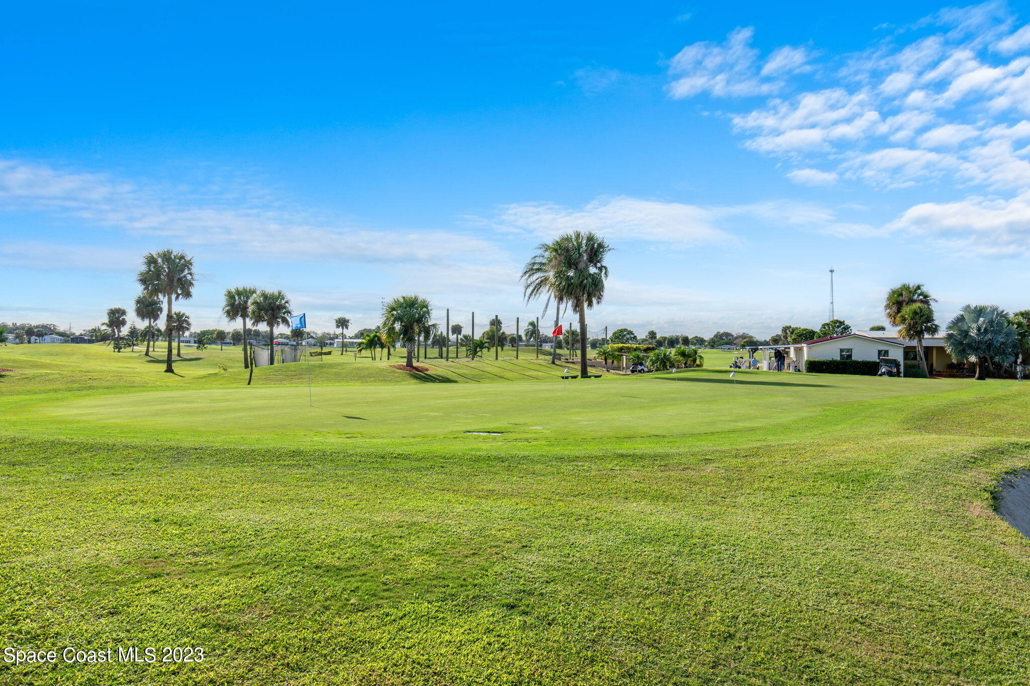 701 Gladiolus Drive Barefoot Bay, FL 32976 - Photo 19 of 19 a view of building with outdoor space