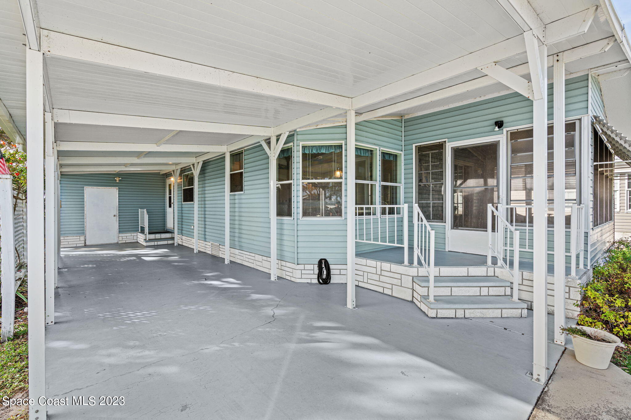 701 Gladiolus Drive Barefoot Bay, FL 32976 - Photo 2 of 19 a view of a building with a outdoor space