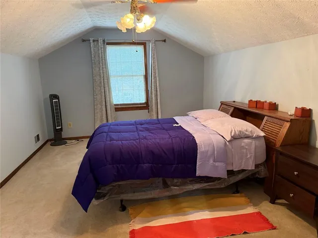 a bathroom with a sink vanity mirror and toilet