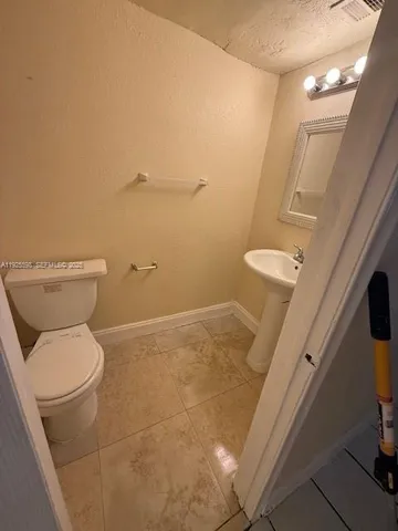 a bathroom with a toilet and a sink