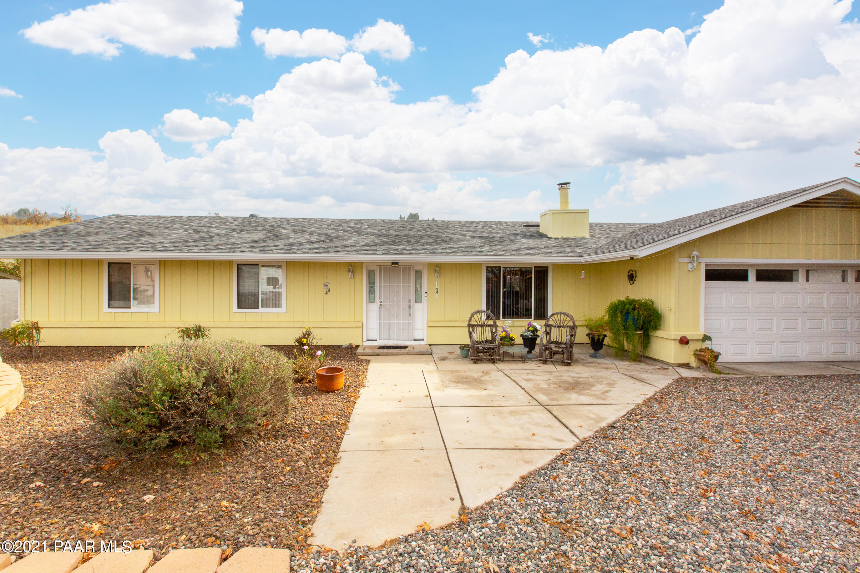 11991 Rawhide Ridge Dewey, AZ 86327 - Photo 1 of 29 a front view of a house with swimming pool and seating