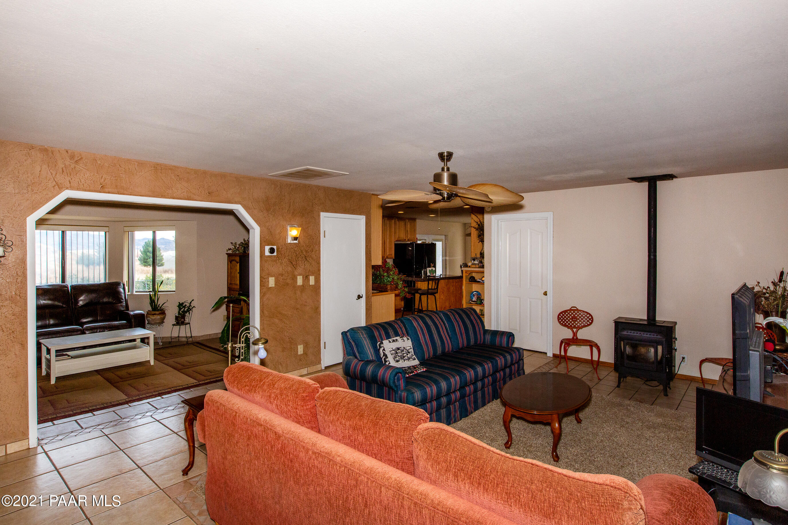 11991 Rawhide Ridge Dewey, AZ 86327 - Photo 11 of 29 a living room with furniture a rug and white walls