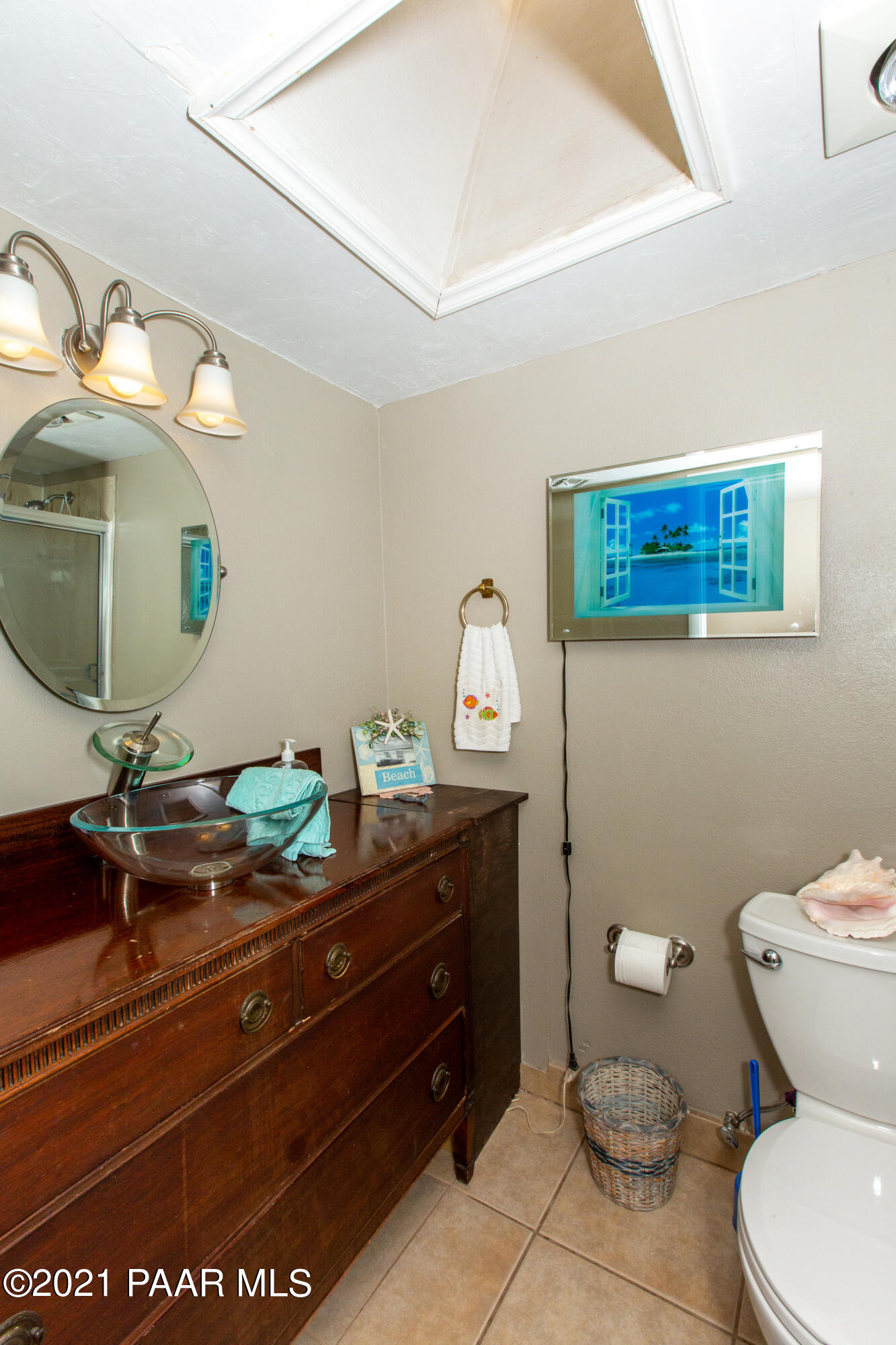 11991 Rawhide Ridge Dewey, AZ 86327 - Photo 18 of 29 a bathroom with a toilet a sink and mirror