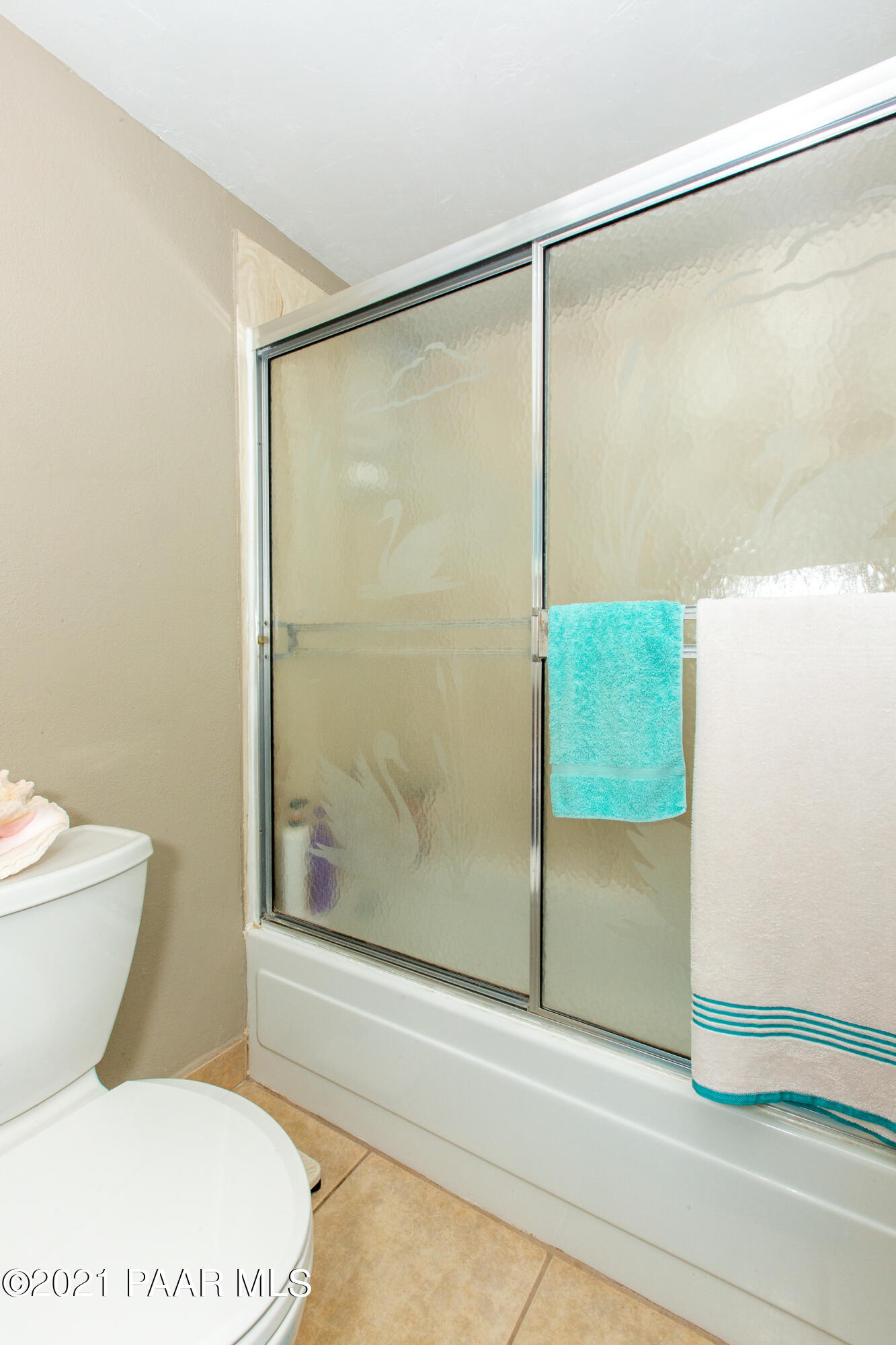11991 Rawhide Ridge Dewey, AZ 86327 - Photo 19 of 29 a bathroom with a shower and a toilet