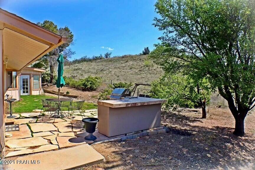 11991 Rawhide Ridge Dewey, AZ 86327 - Photo 27 of 29 a view of a backyard with sitting area