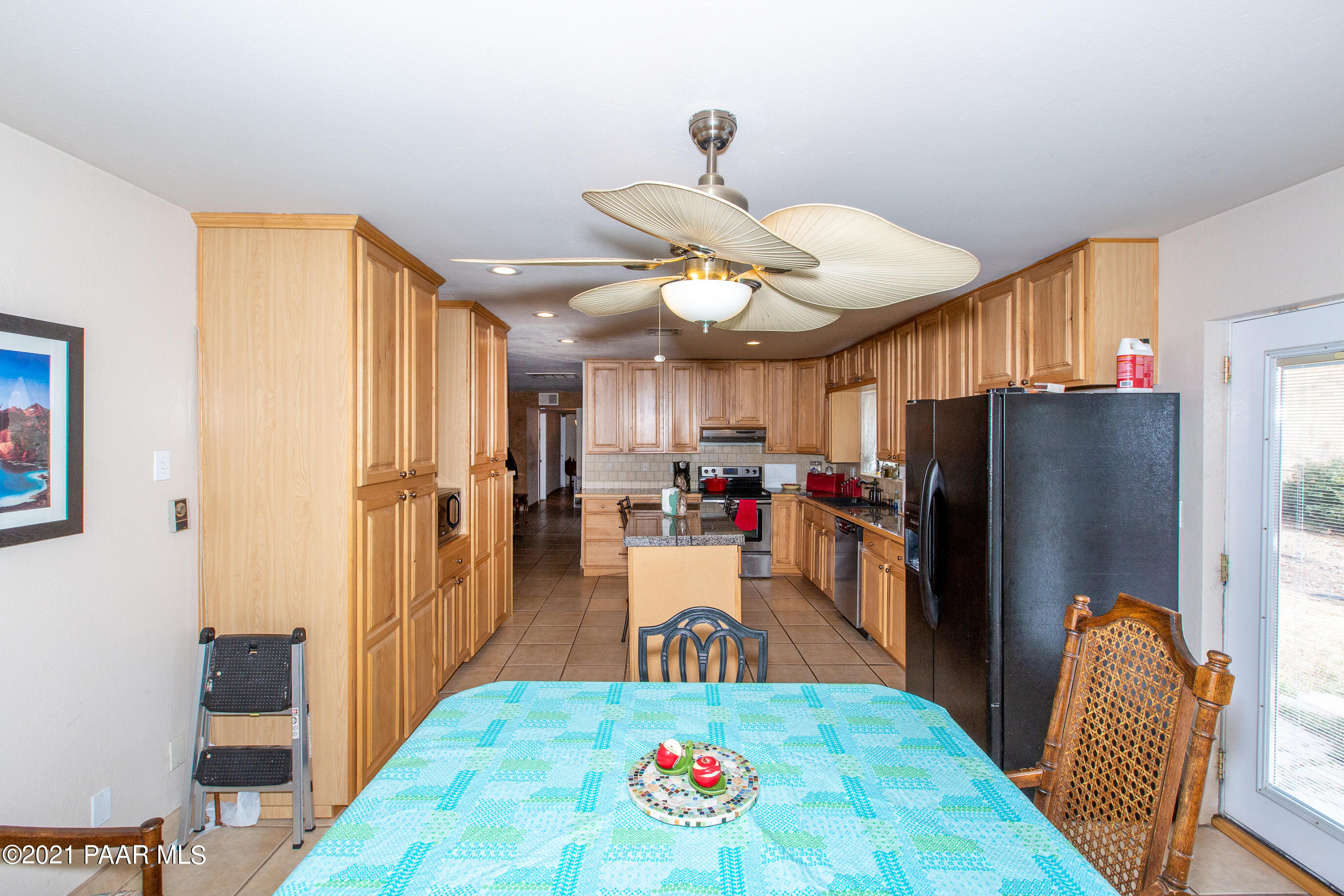 11991 Rawhide Ridge Dewey, AZ 86327 - Photo 5 of 29 a kitchen with stainless steel appliances granite countertop a refrigerator a stove and a sink