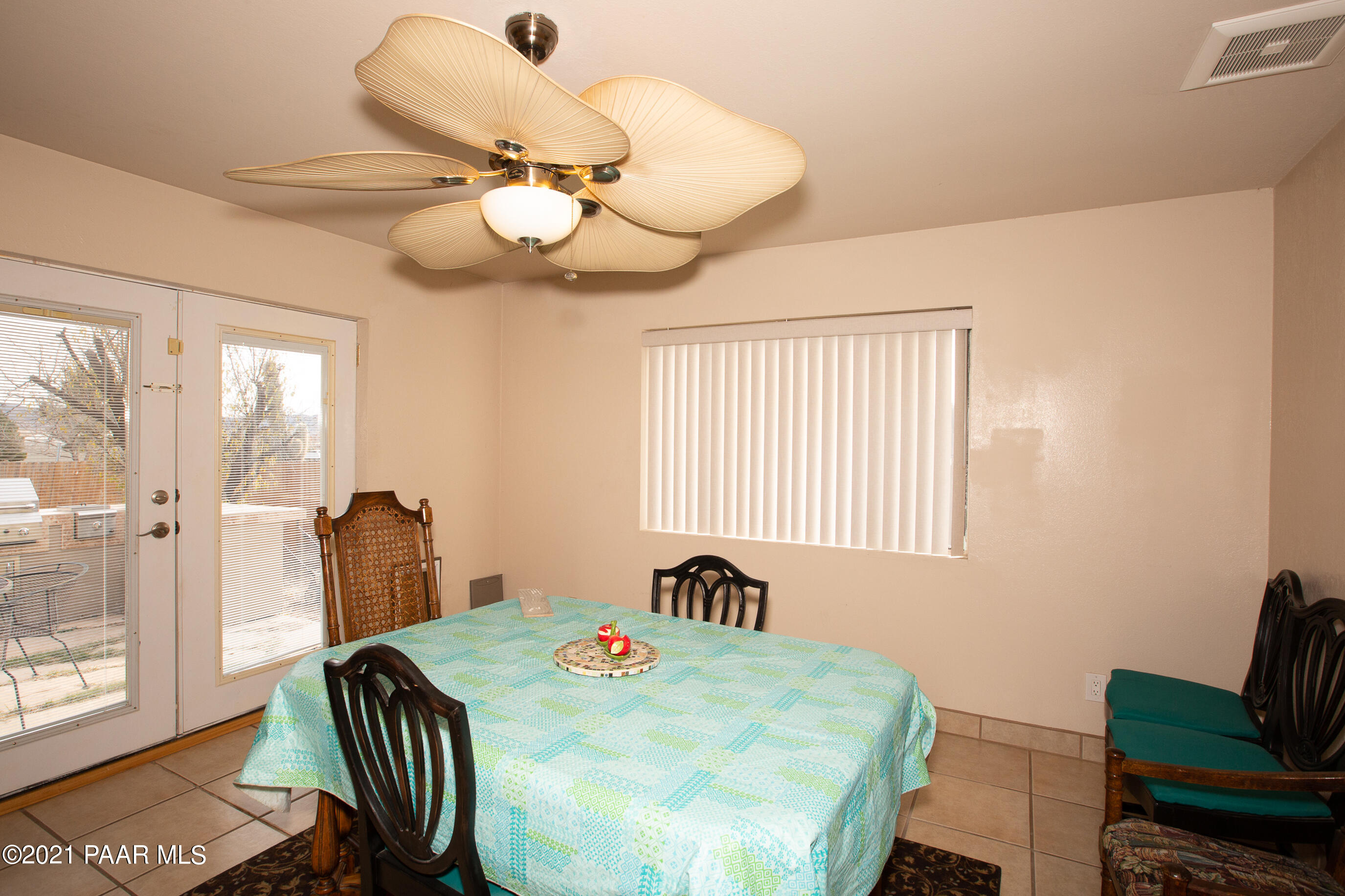11991 Rawhide Ridge Dewey, AZ 86327 - Photo 10 of 29 a view of a dining room with furniture and wooden floor