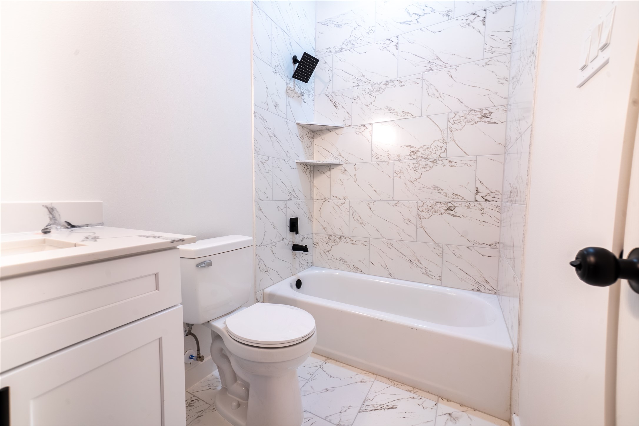 331 Delaware Street Houston, TX 77029 - Photo 8 of 12 a bathroom with a bathtub sink vanity mirror and toilet