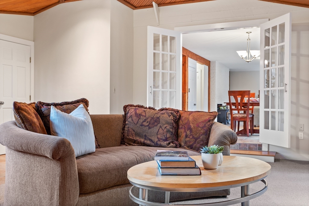 103 Newtown Road Acton, MA 01720 - Photo 11 of 42 a living room with furniture and a large window