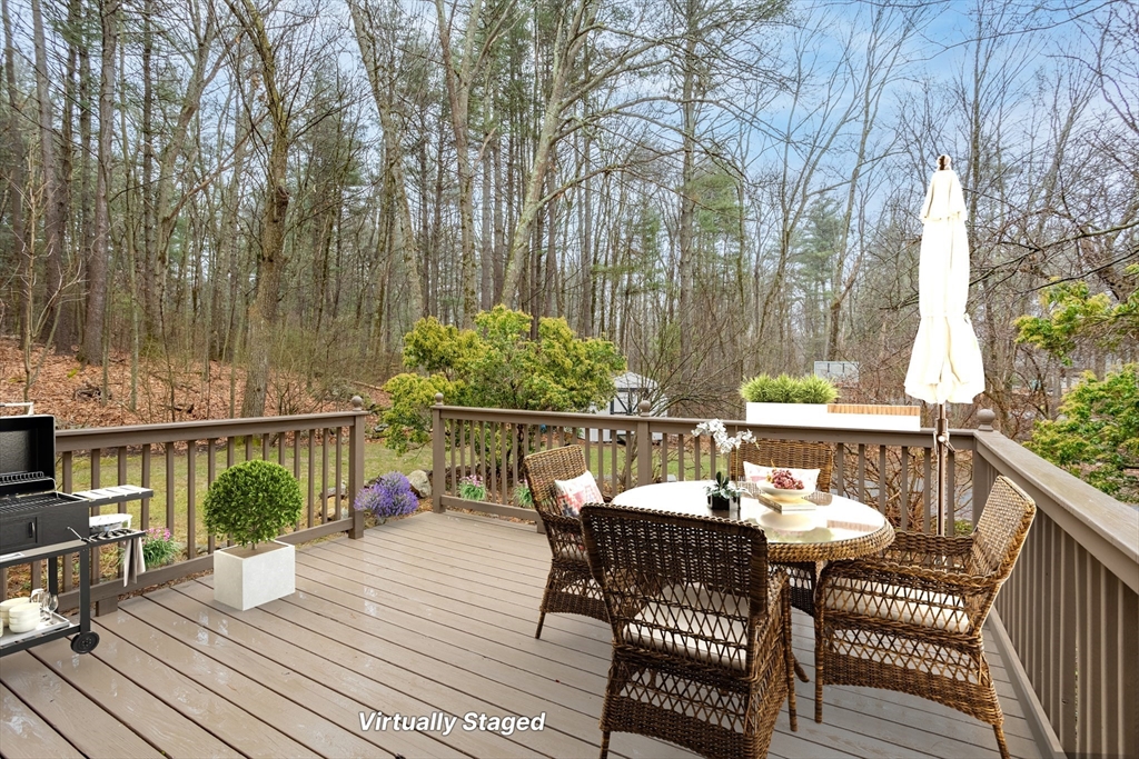 103 Newtown Road Acton, MA 01720 - Photo 14 of 42 a view of a chairs and table on the wooden floor