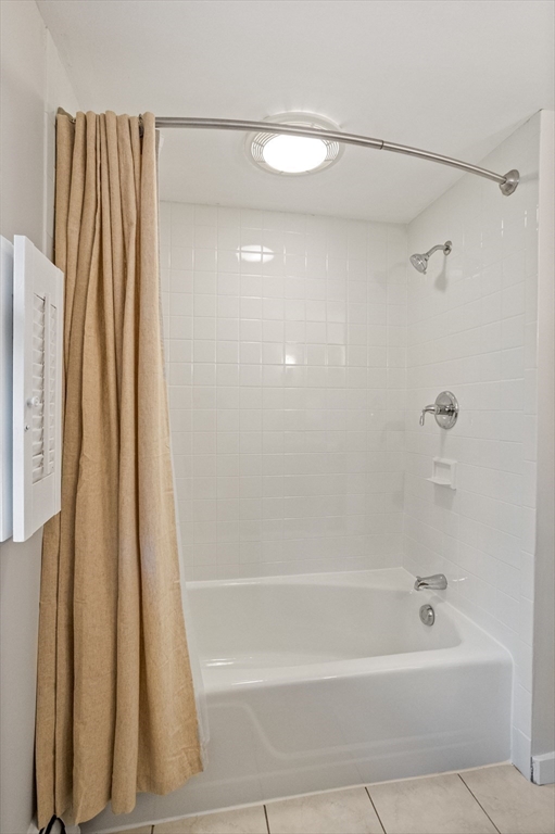 103 Newtown Road Acton, MA 01720 - Photo 26 of 42 a bathroom with a shower a bath tub and a shower