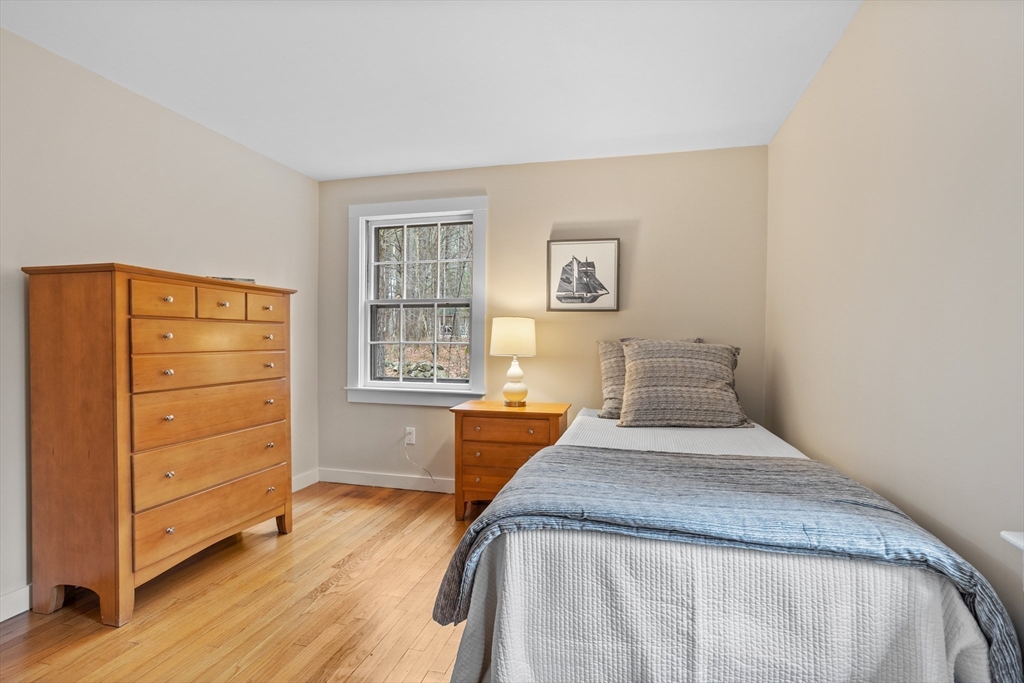 103 Newtown Road Acton, MA 01720 - Photo 27 of 42 a bedroom with a bed and a window