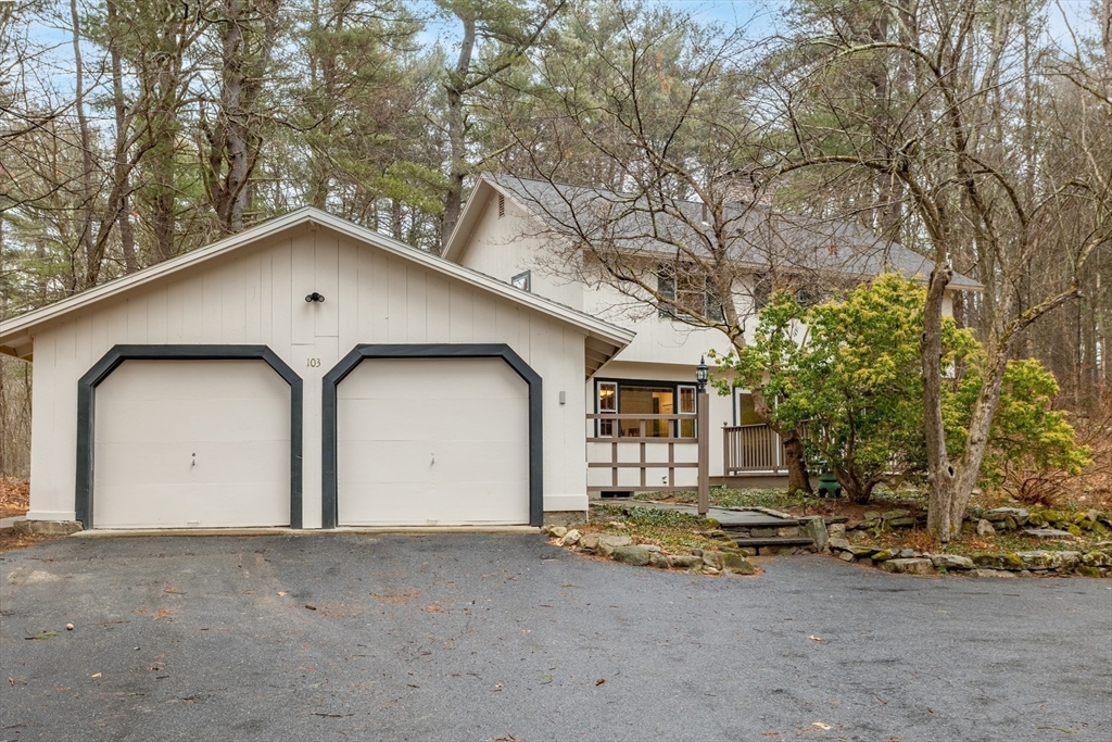 103 Newtown Road Acton, MA 01720 - Photo 31 of 42 a view of a house with a yard and garage