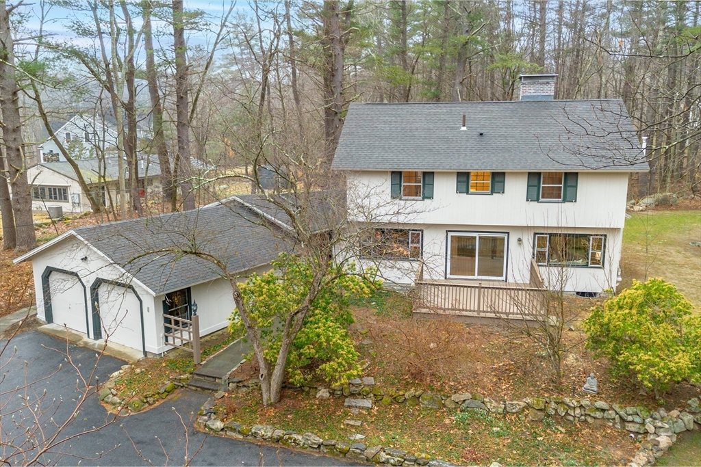 103 Newtown Road Acton, MA 01720 - Photo 39 of 42 front view of a house with a yard