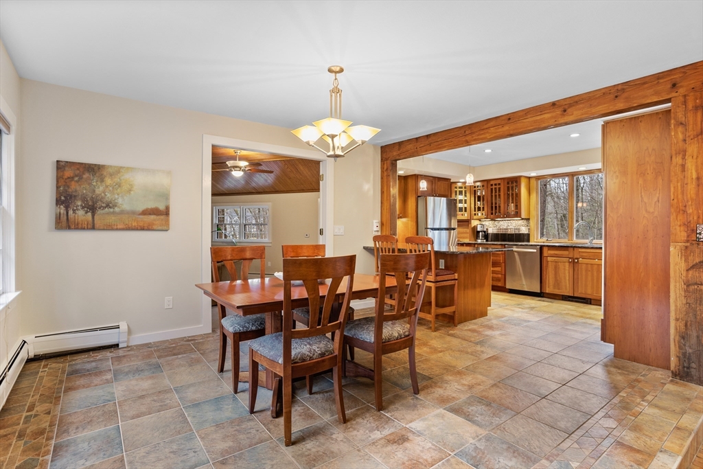 103 Newtown Road Acton, MA 01720 - Photo 6 of 42 a view of a dining room with furniture