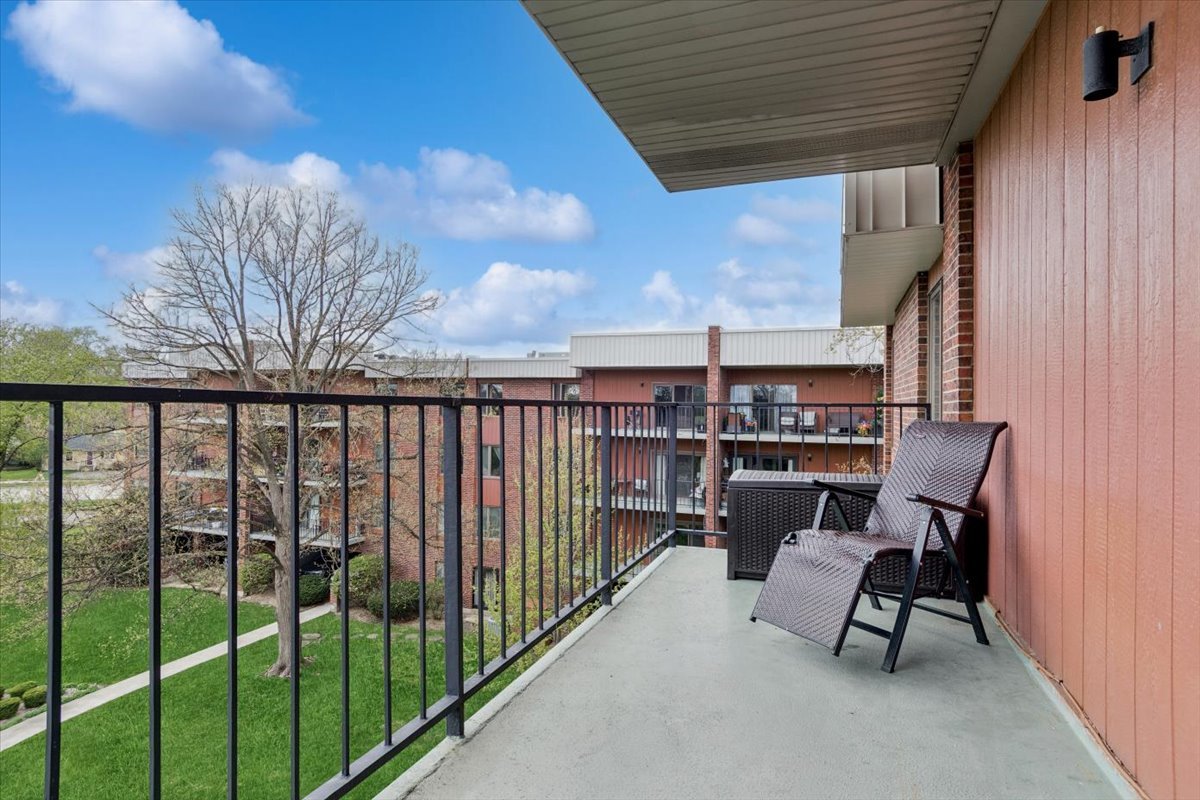 6545 Main Street, Unit 407 Downers Grove, IL 60516 - Photo 15 of 18 a view of a chairs and table in the balcony
